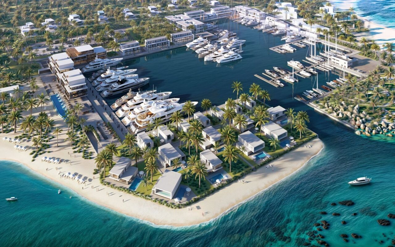 Renderização do Port Nimara, em Anguilla, mostra a marina com iates, as vilas à beira-mar e a faixa de praia
